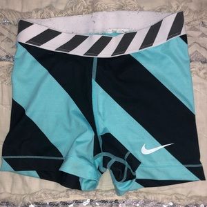 Teal & black striped Nike Pros